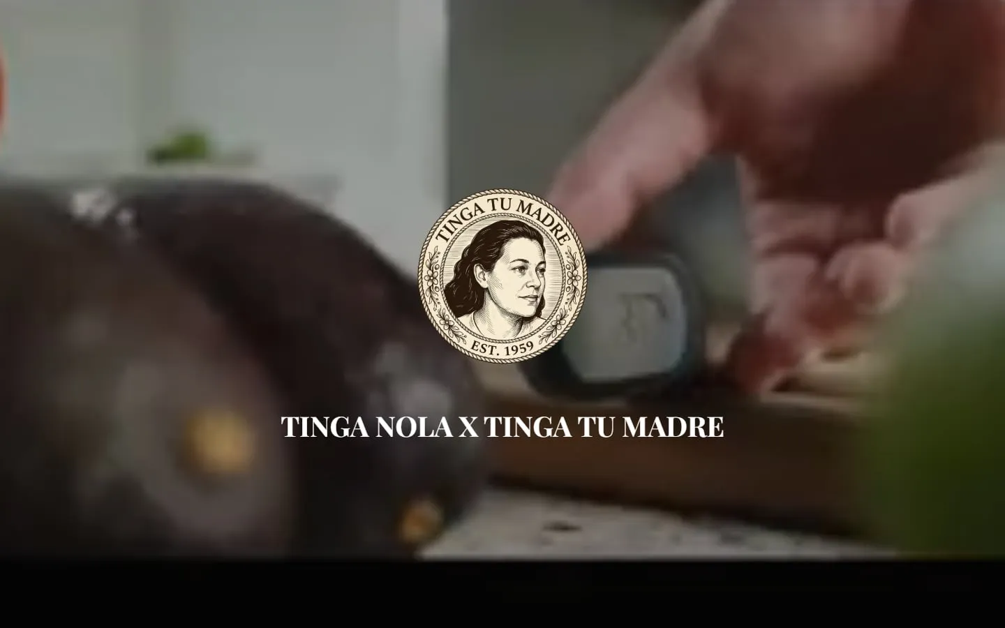 The Tinga Tu Madre home page: the Tinga Tu Madre seal and "Tinga NOLA x Tinga Tu Madre" over a full-screen video of food being prepared.